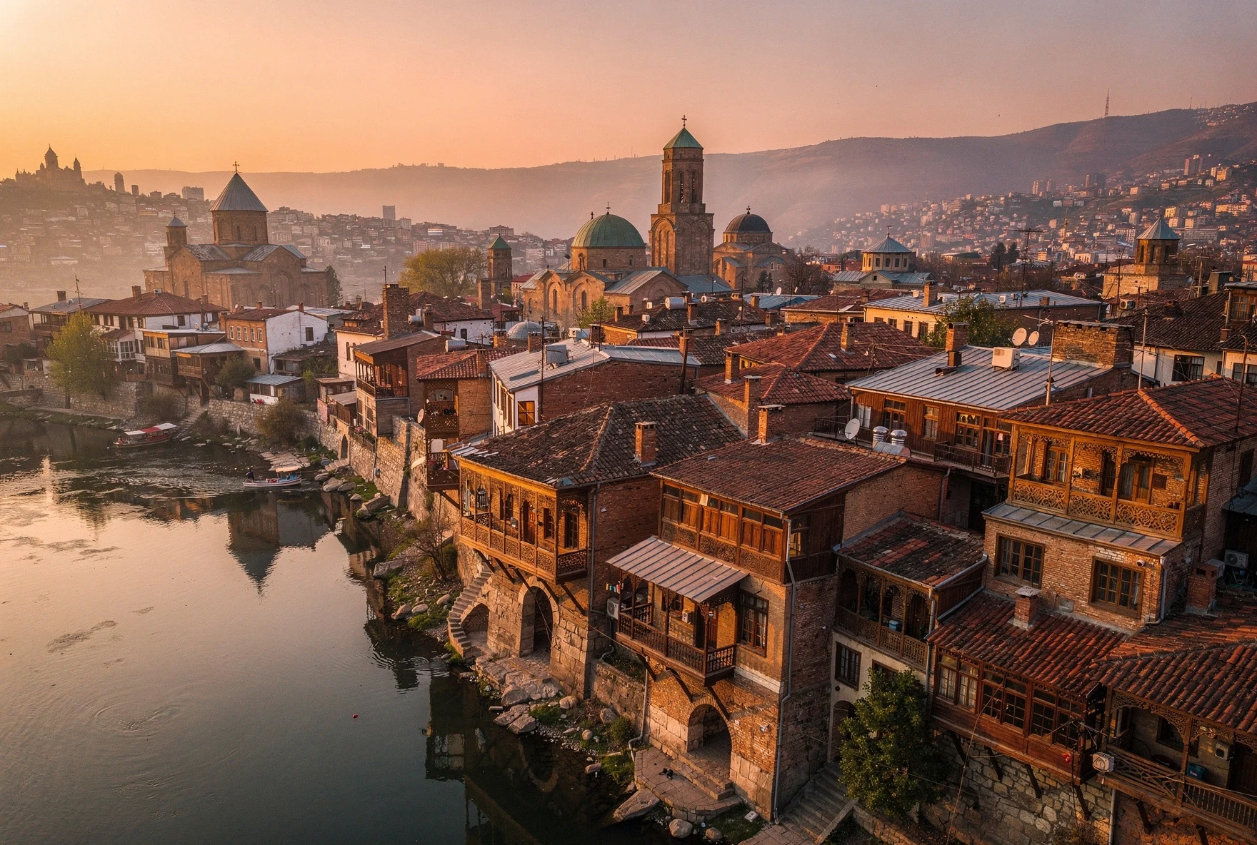 Sunset view over Tbilisi old town rooftops and the Kura River