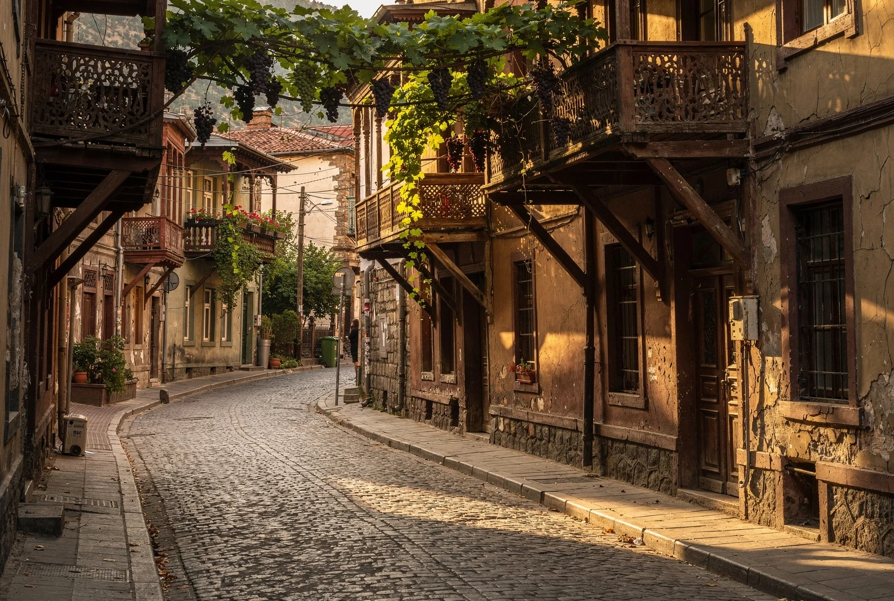 Cobblestone street in old Tbilisi with traditional wooden balconies