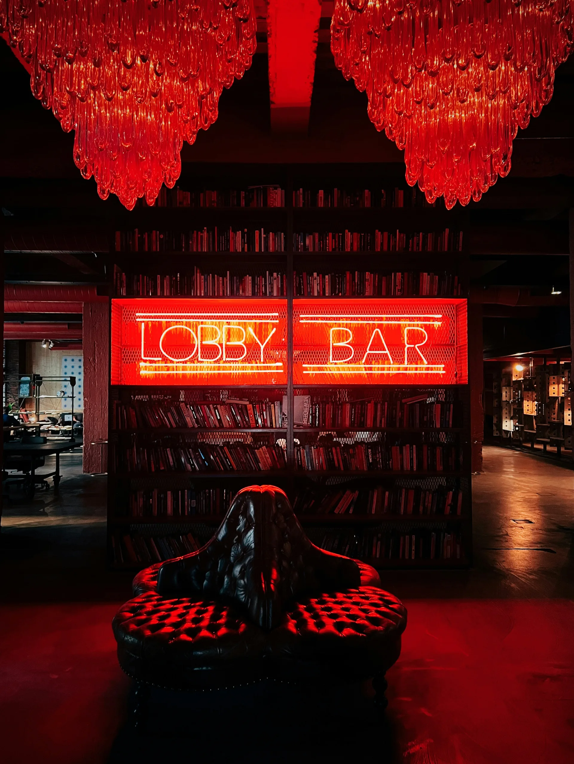 Atmospheric lobby bar in Tbilisi with red neon sign and moody lighting