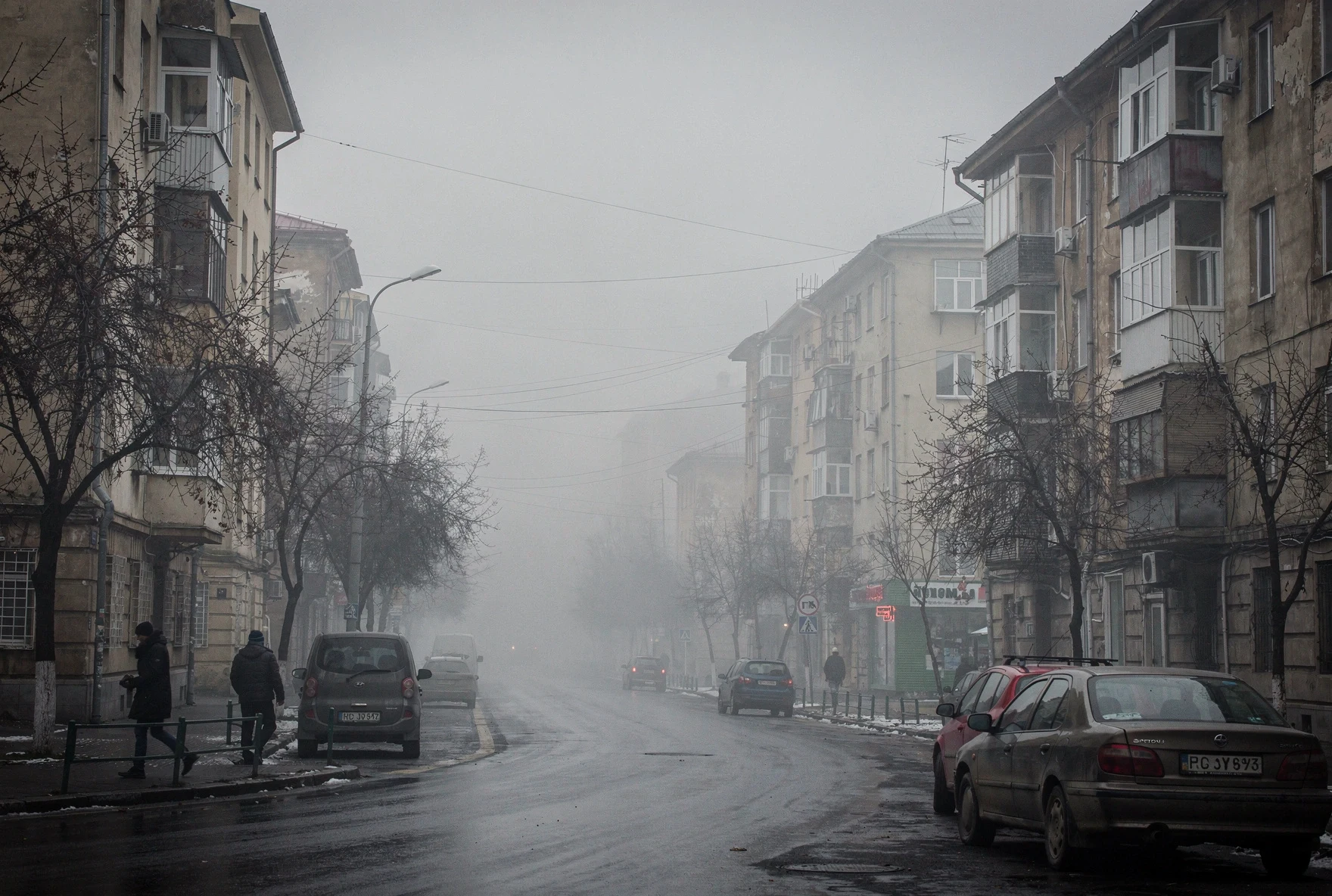 Tbilisi street on a hazy winter day with buildings fading into smog