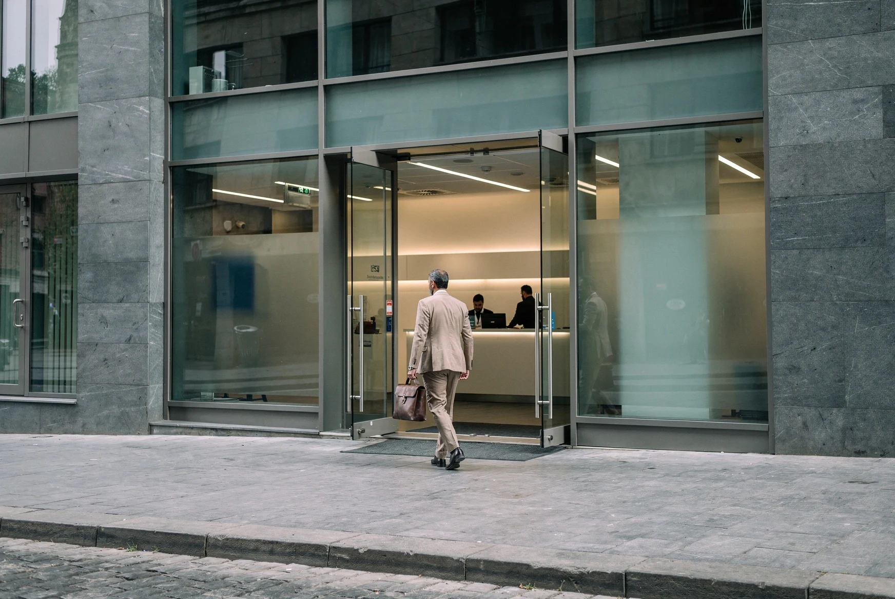 Foreign founder entering a modern bank branch in Tbilisi