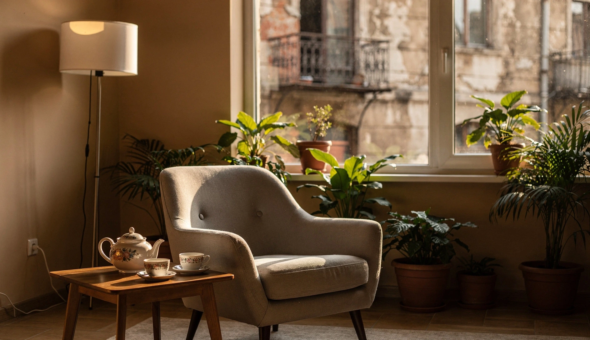 Cozy therapy office interior in Tbilisi with armchair, plants, and warm lighting
