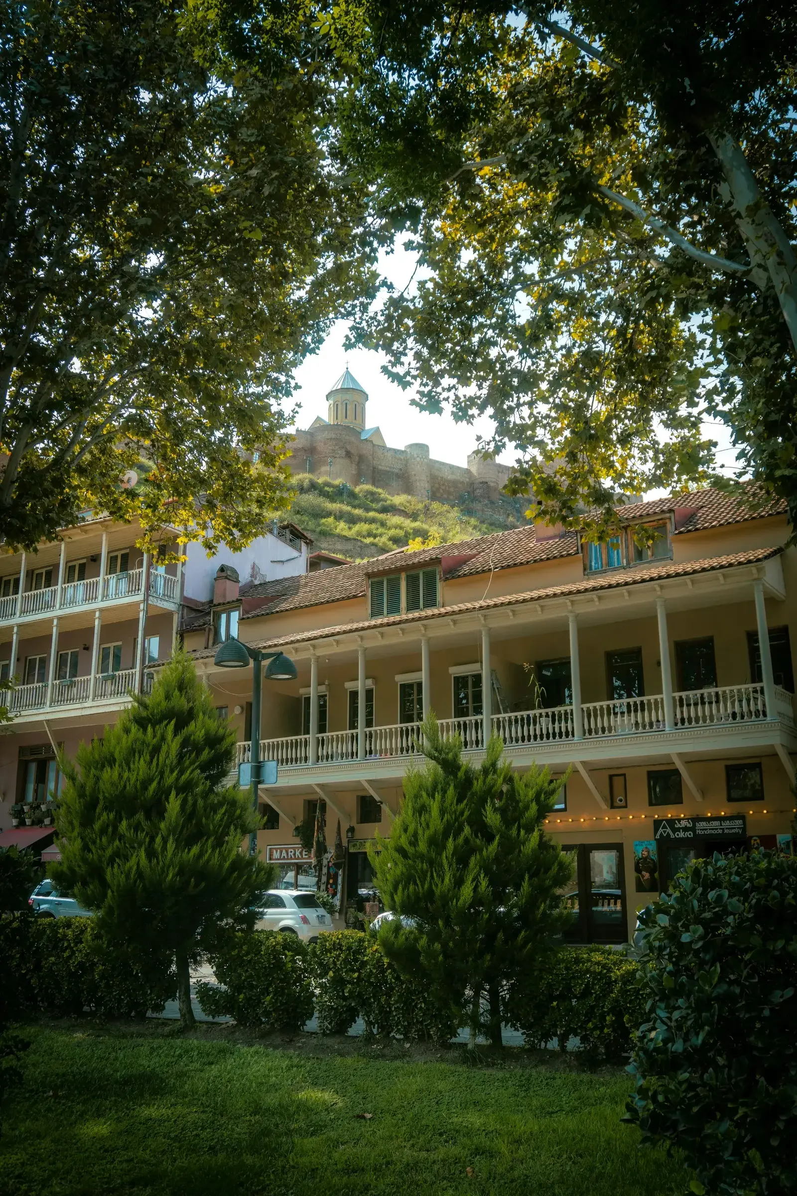 Narrow cobblestone street with traditional balconies in Tbilisi's Old Town