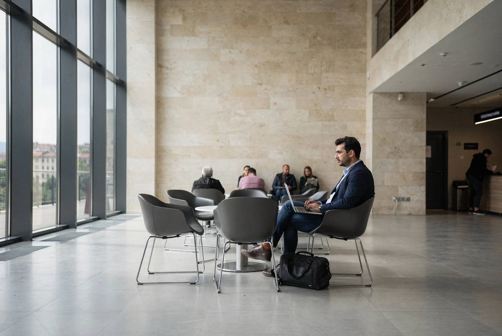 Foreign entrepreneur waiting inside a modern Georgian public service hall